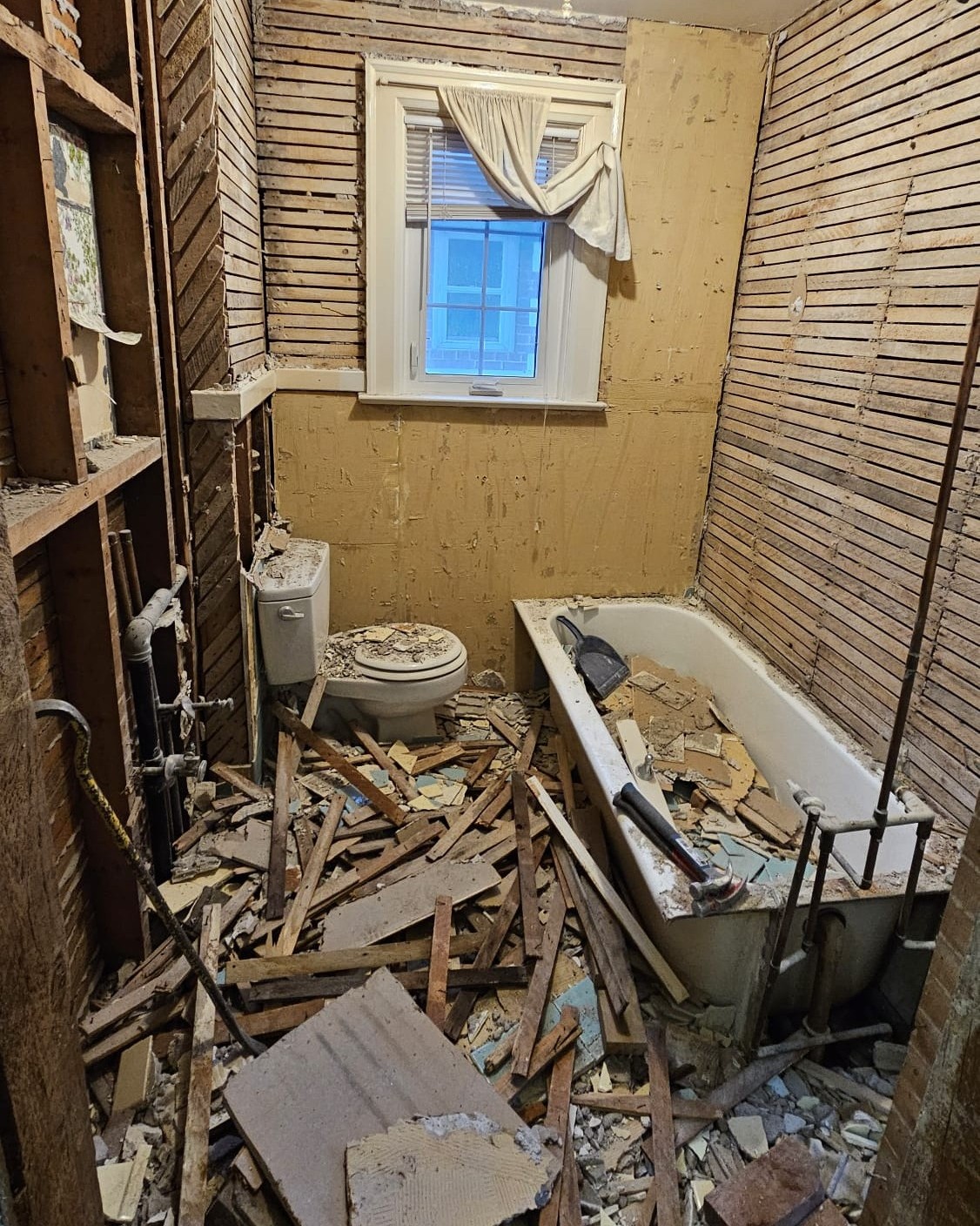 Bathroom finishes removed during full home renovation in Midtown Toronto