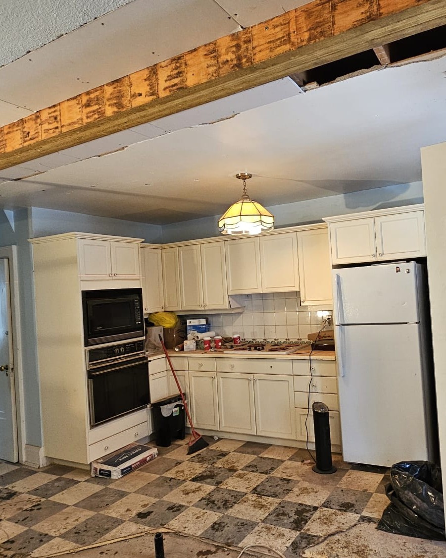 Kitchen wall removed to create open concept layout during home renovation in Midtown Toronto