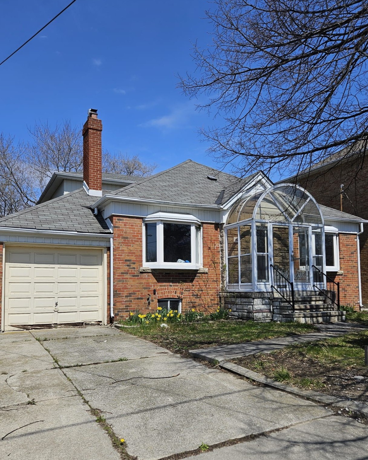 Original bungalow before demolition for custom home construction in North York