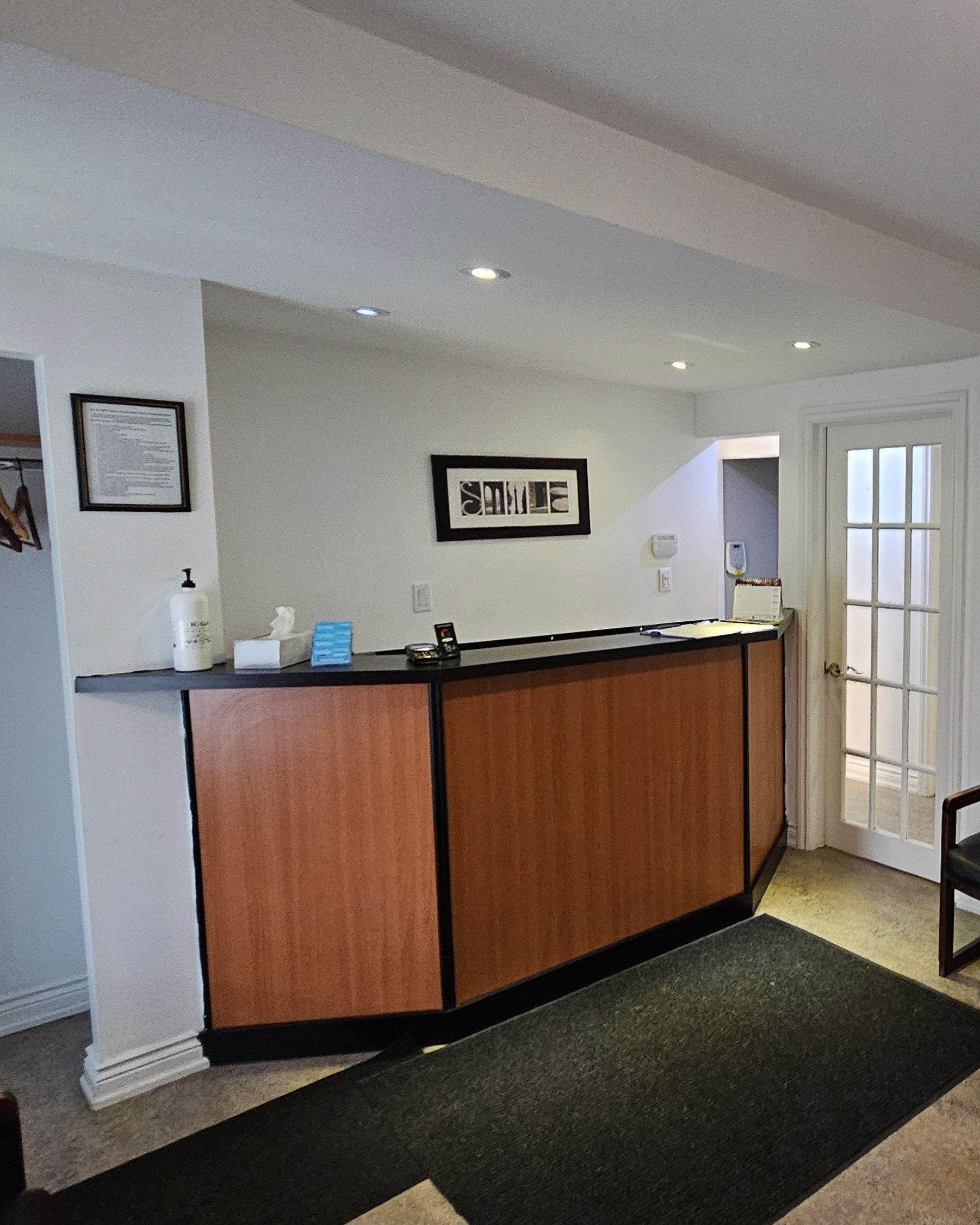 Original outdated waiting area before renovation at Toronto clinic