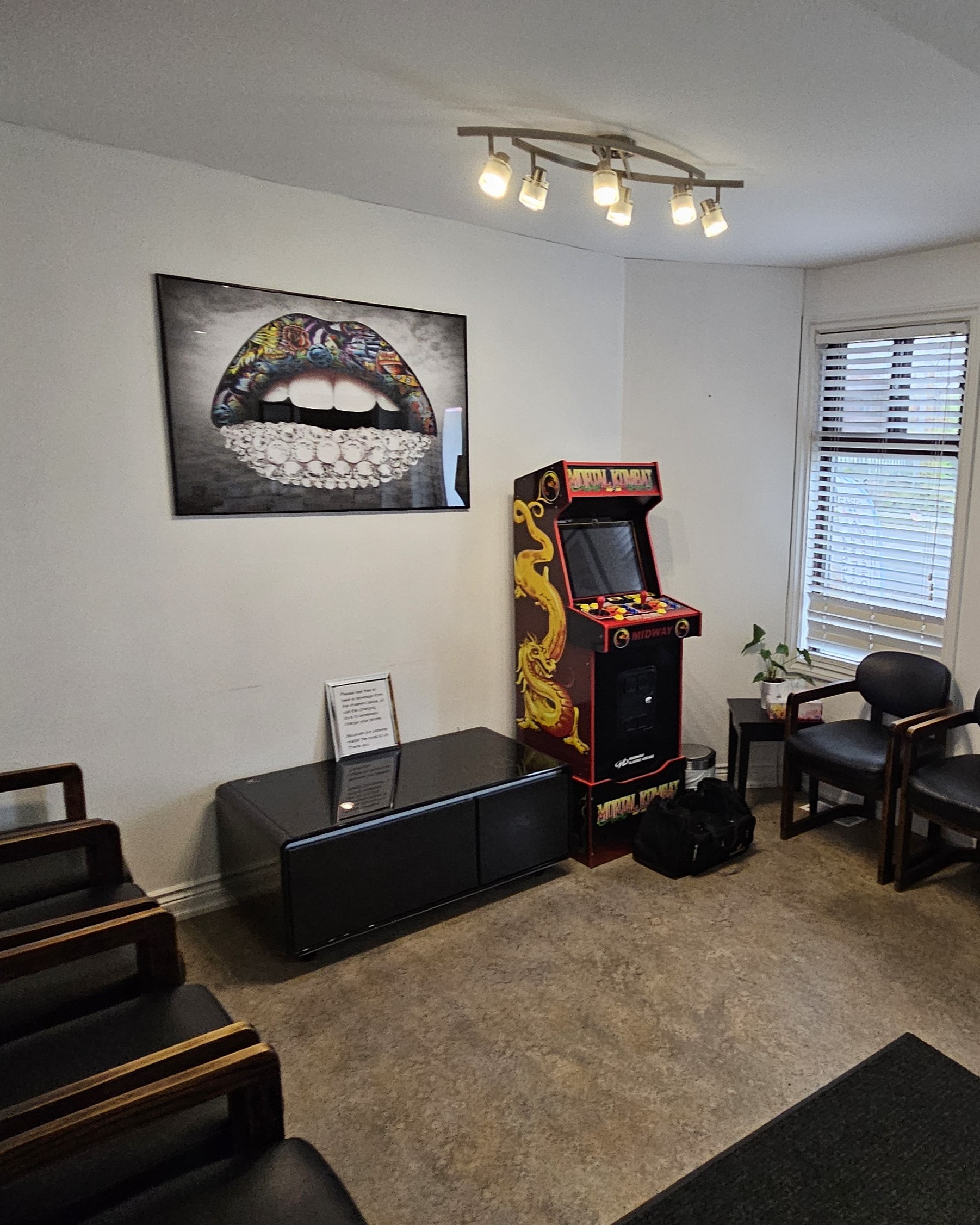 Old waiting room with worn finishes before renovation in Toronto clinic