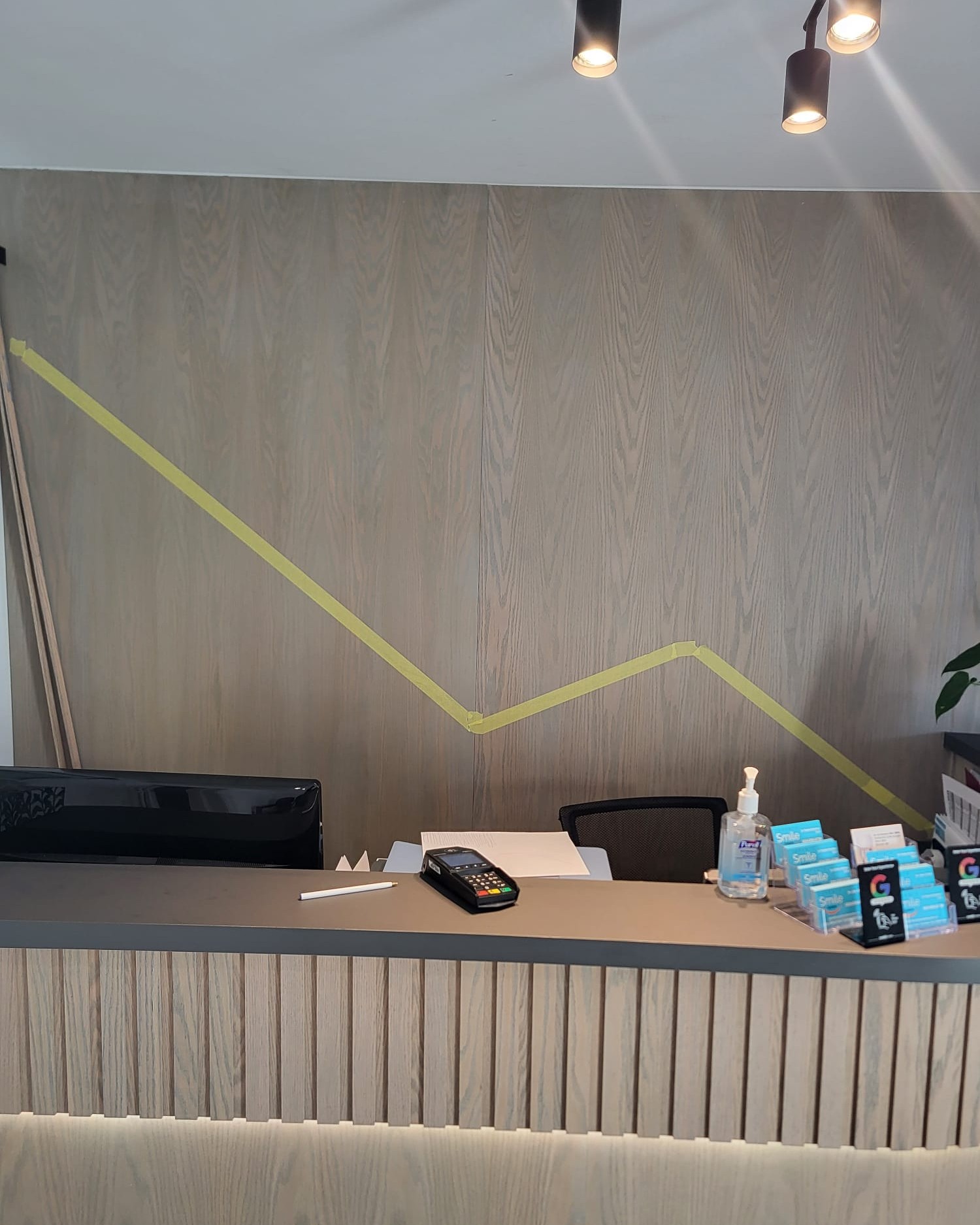 Red oak wall panel trims installed during interior renovation in Toronto clinic