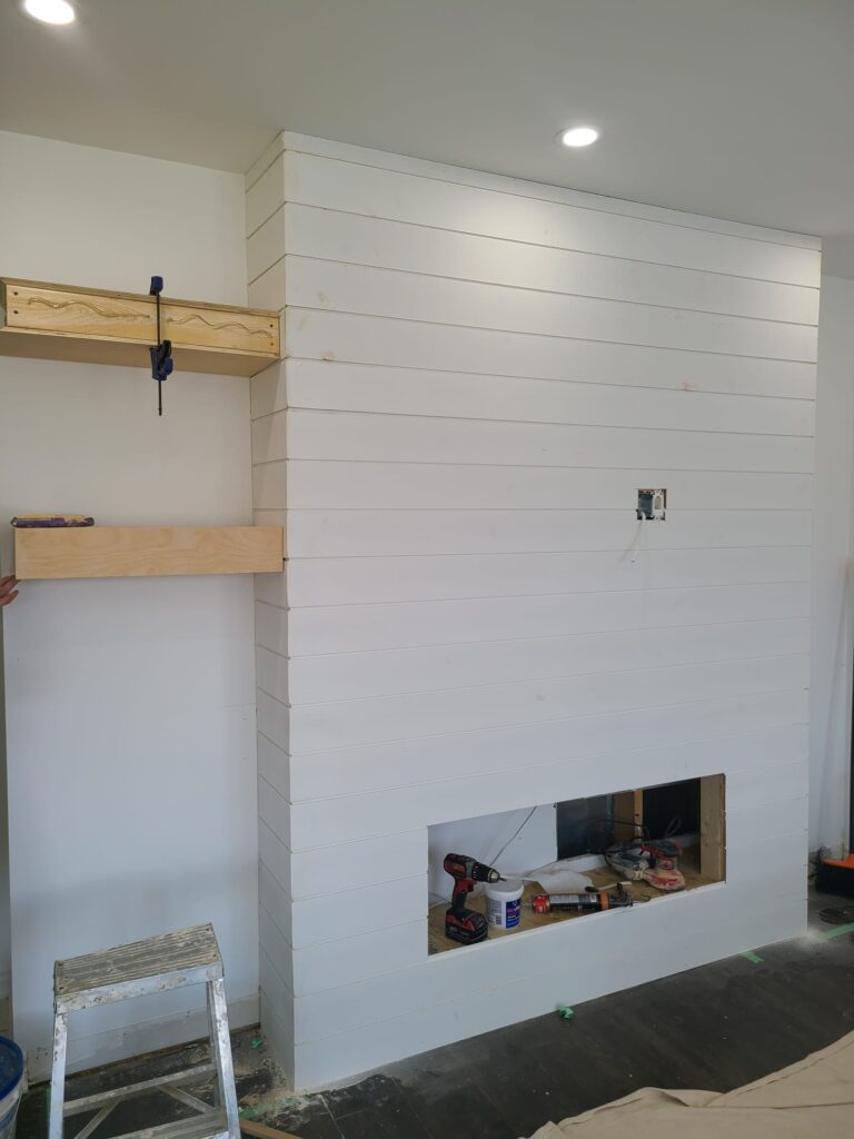 TV wall panels installed and prepared for painting during renovation in Toronto