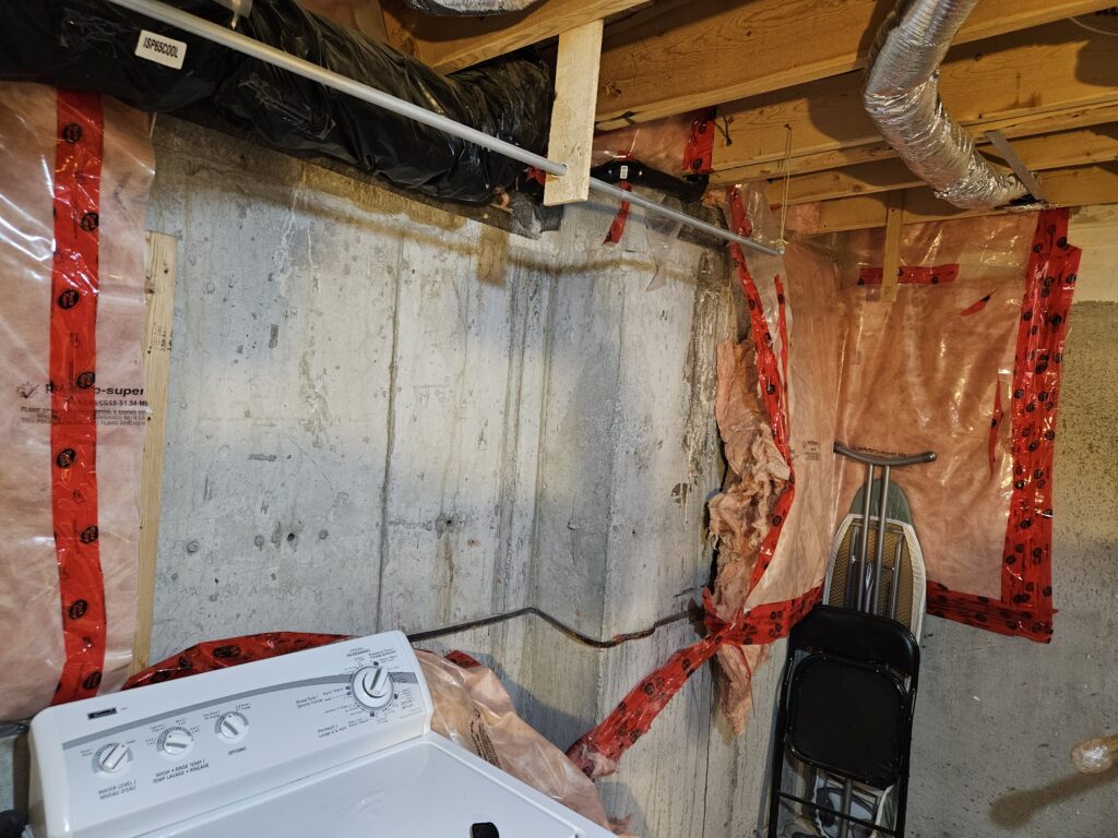 Active water leaks visible on interior basement walls due to failed exterior waterproofing