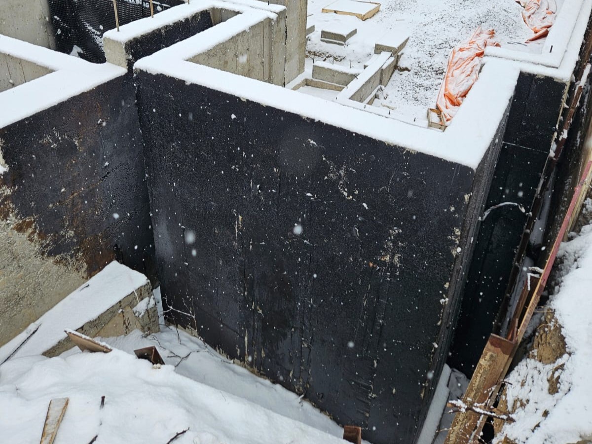 Dampproofing material applied to exterior foundation wall as part of basic moisture protection system