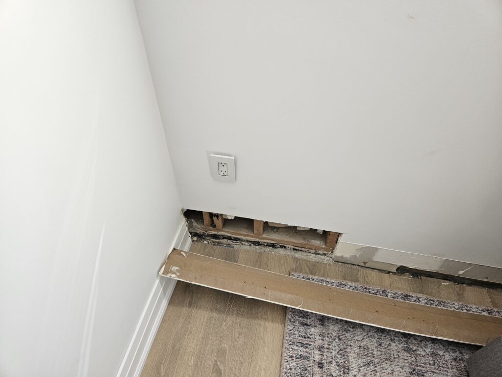 Section of interior wall removed to review behind finishes and monitor for water leaks during testing