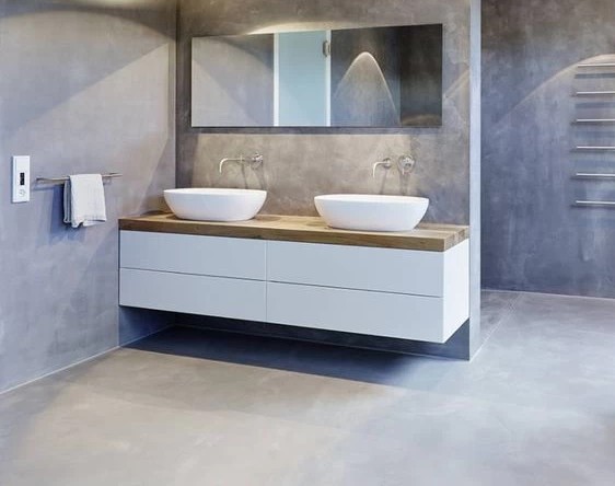 seamless microcement flooring in a minimalist modern bathroom