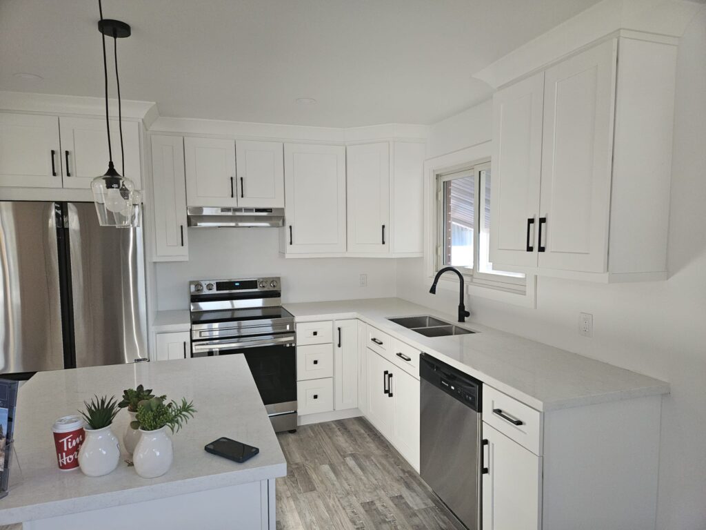A simple small kitchen design with compact layout, light cabinets, and efficient storage solutions







