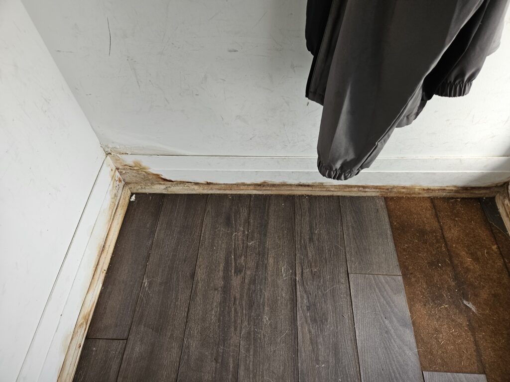 Stained and water-damaged basement walls showing clear signs of water leakage