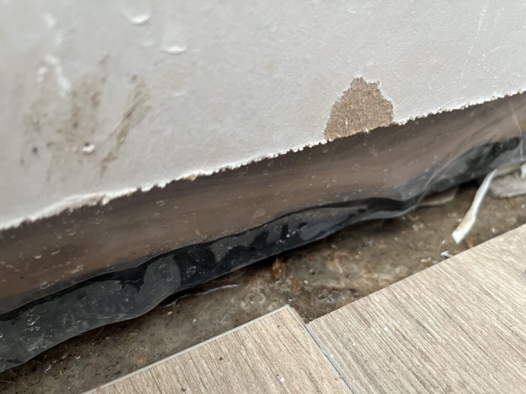 Water penetration observed through the wall assembly during water testing with blower door setup