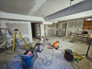 Basement under construction in a Toronto home with exposed framing and insulation