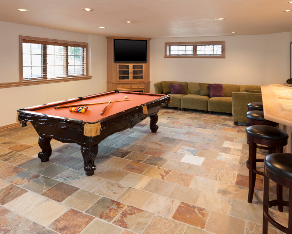 Finished basement designed as a recreational space with seating and entertainment area