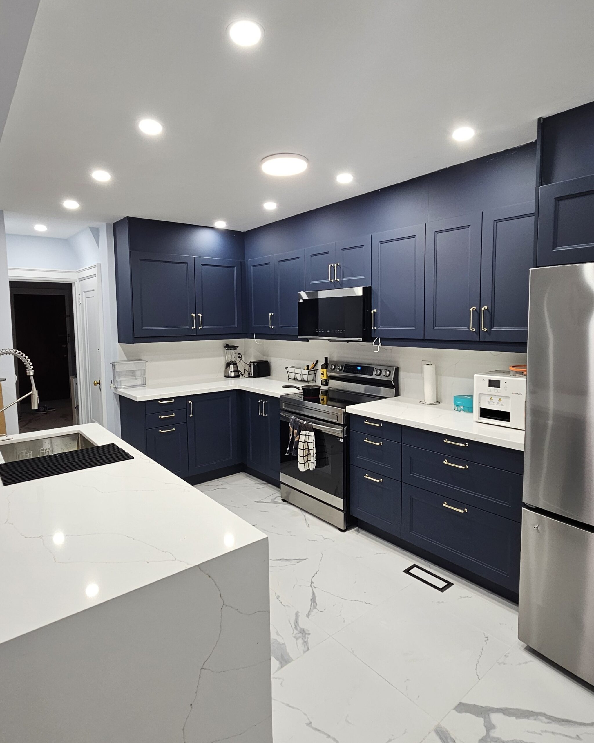 Renovated kitchen with modern cabinetry, updated appliances, and a sleek, functional layout