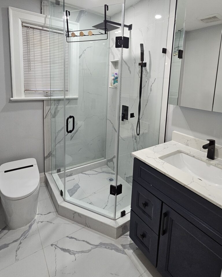 Modern newly renovated bathroom with sleek fixtures, tiled walls, and a clean contemporary design