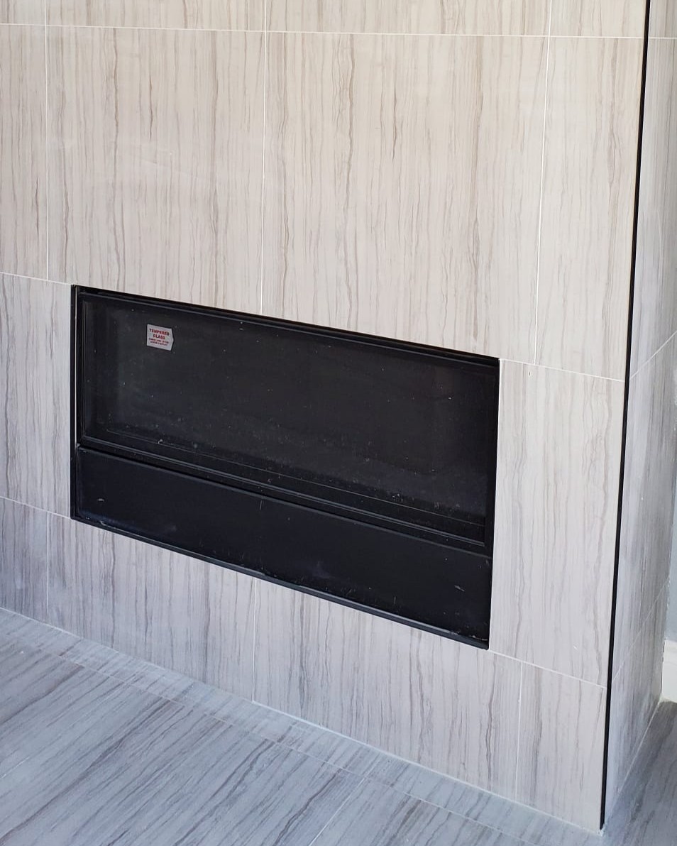 Final interior finishes completed with modern fireplace installed in custom cabana house in Central Ajax.