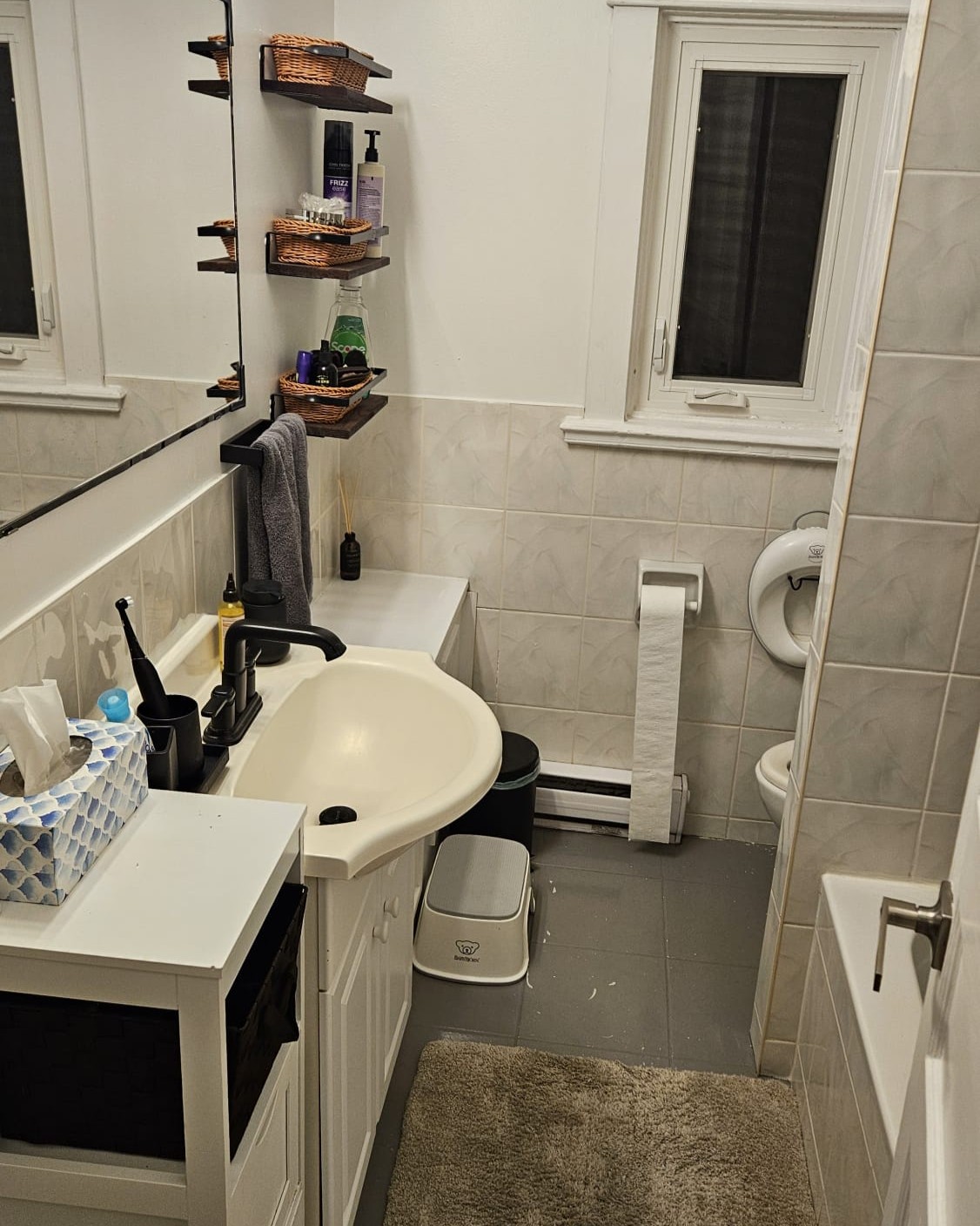 Before photo of an outdated bathroom with old finishes and an impractical layout requiring a full redesign and renovation.