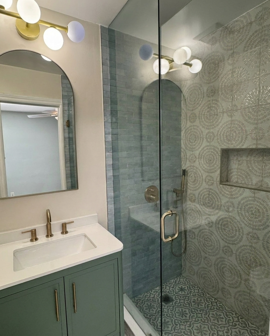 Newly added custom bathroom with green vanity and patterned tile — Toronto