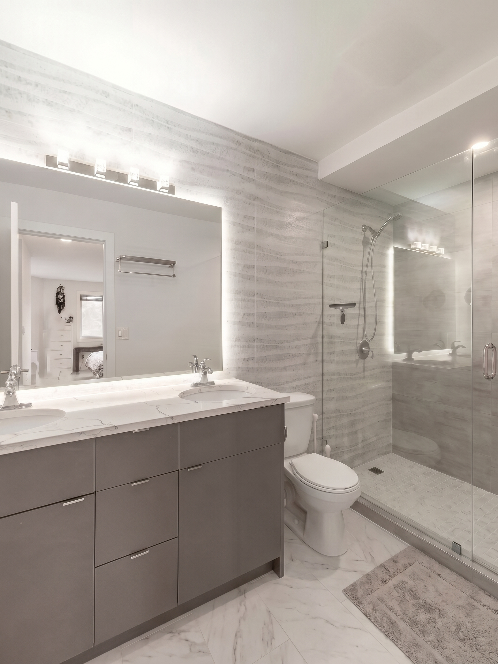 Contemporary bathroom renovation with quartz countertop, custom vanity, and upgraded lighting in North York, ON